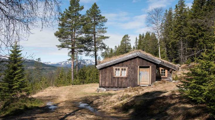 A log cabin in a forest clearing for a holiday in Norway and top winter escapes in Europe.