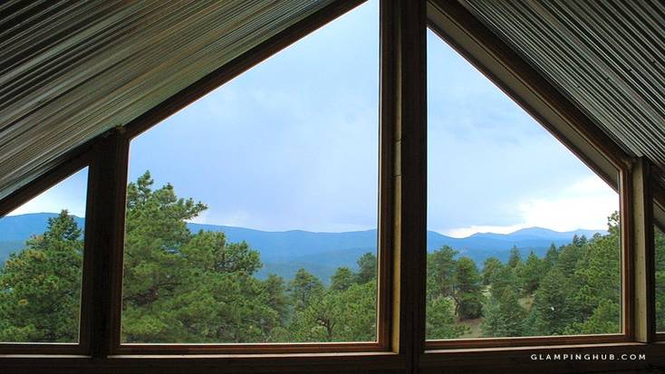 View of mountains from Colorado glamping rental perfect for romantic cabin winter getaways for two 