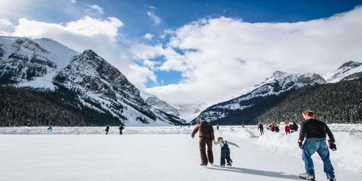 Image of family on the ice enjoying some of the best winter vacations in the US for the year of 2020