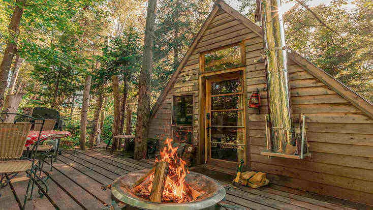 Tree house in Quebec with private deck.