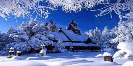 A rustic property in a snow covered forest, another one of the best gifts for boyfriends parents in 2020