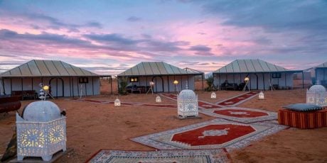 Moroccan tents in the desert for glamping and 2020 travel trends.