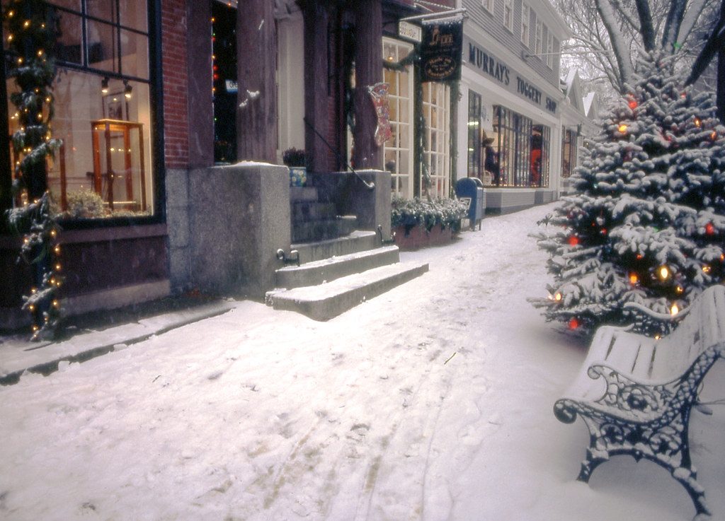 The snow-covered main street in Nantucket with Christmas decorations and lights