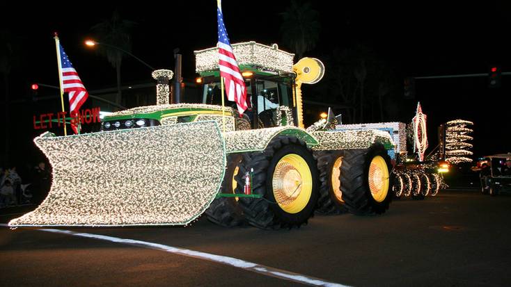 A large John Deere tractor decorated with Christmas lights for the annual Palm Springs Festival of Lights Parade 