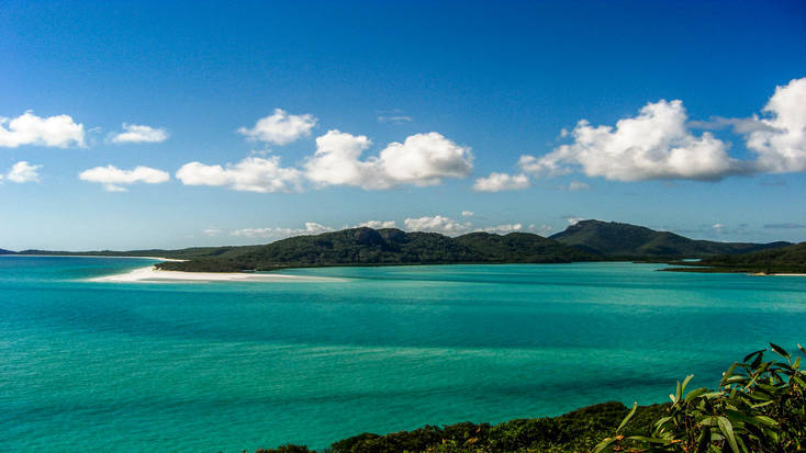 A photo over a cove in the Whitsunday Islands