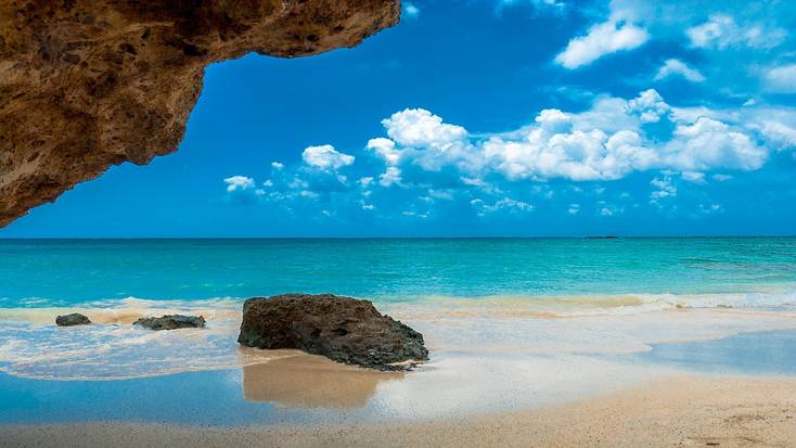 Bright blue water from and white sand on Elafonisi Beach, one of the best beaches in Crete