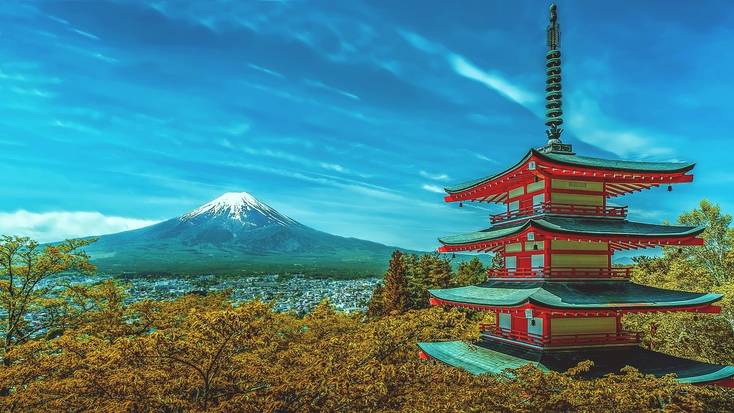 A pagoda in  Japan with views of the snow-capped Mount Fuji.