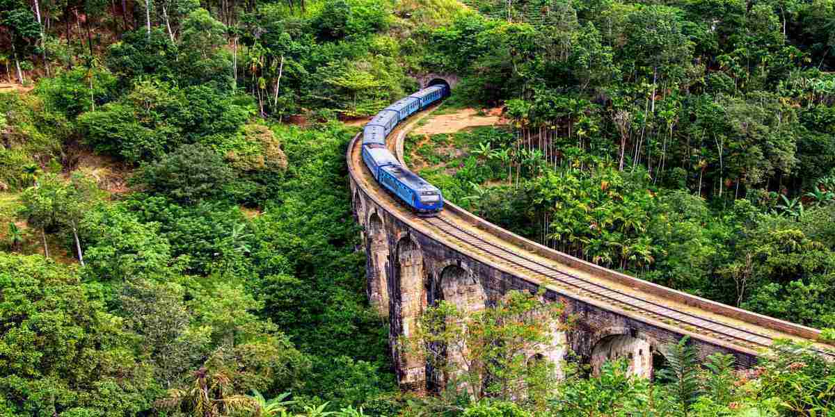 Image of blue train going through hills in the Sri Lankan New Year