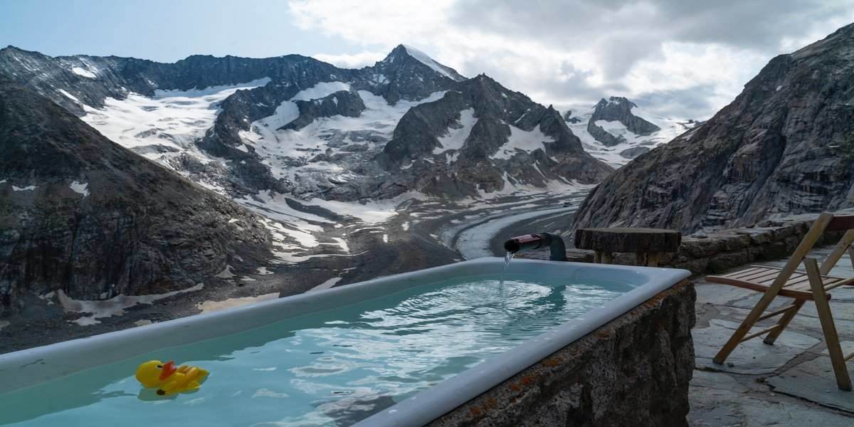 A outdoor hot tub with mountain views.