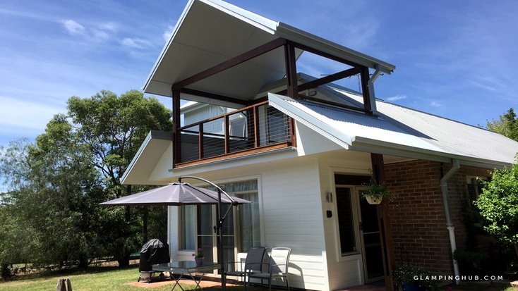 View from the outside of modern luxury camping rental, NSW where glampers can stay for weekend of Australia Day 2020. 
