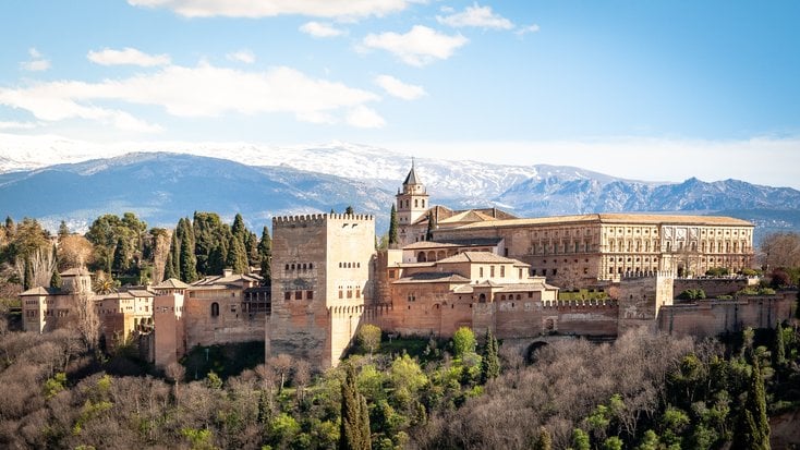 A shot of one of the top honeymoon destinations in Spain and the Alhambra palace from a distance.

