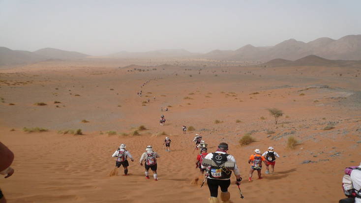 Competitors tackle a sand dune in the Marathon de Sables