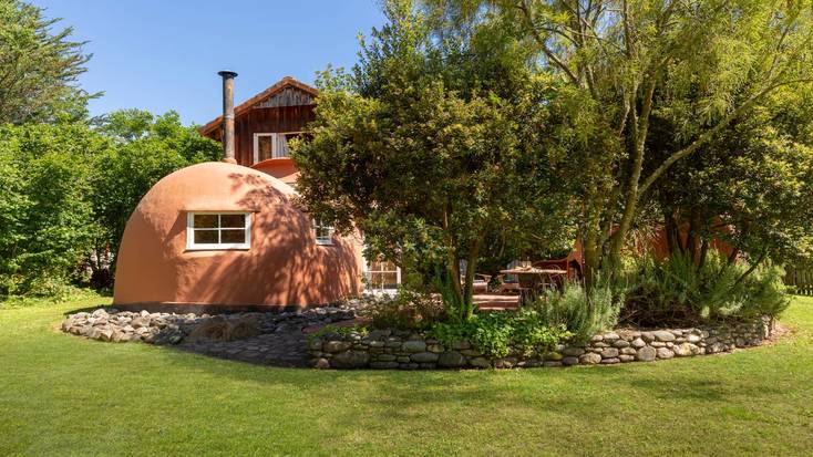 The unique boot-shaped cabin in the idyllic garden