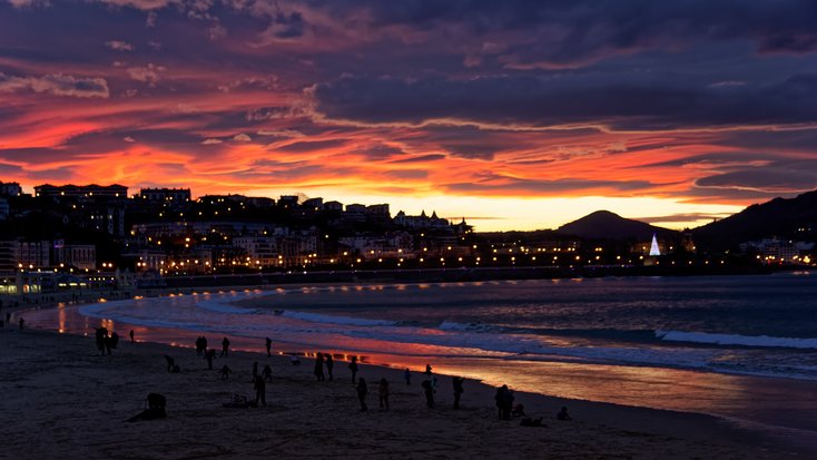 Beautiful view of San Sebastian as one of the top honeymoon destinations in Spain, at Playa de la Concha at night 