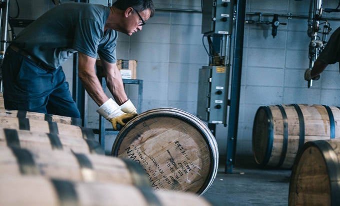 An employee barreling at Bardstown distillery