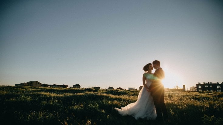 A bride and groom at sunrise in California.