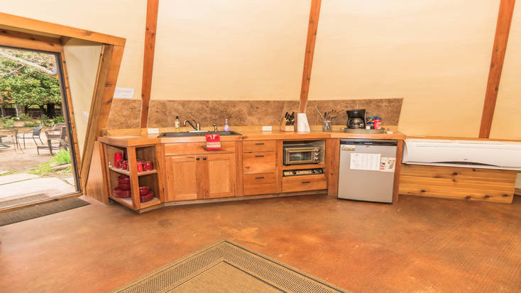 The fully-fitted kitchenette by the entrance of the tipi