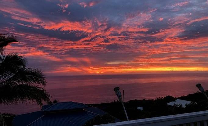 The sun setting over the ocean in Hawaii