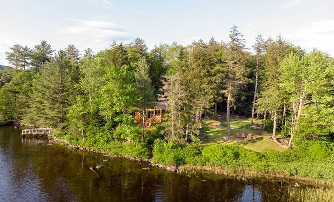 One of our cabin rentals on the shore of a lake in the Adirondacks.