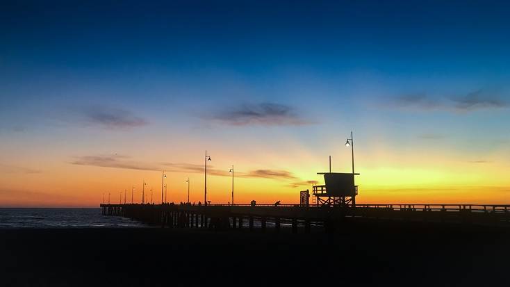 The boardwalk on Venice Beach, California, at sunset