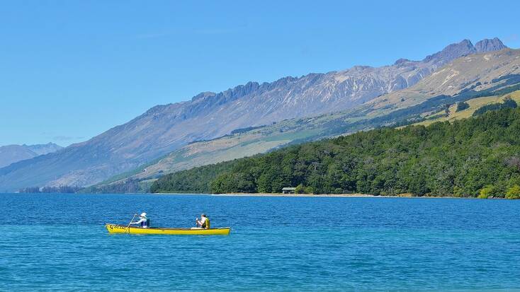 Canoeing on Lake Wakatipu, New Zealand. Vacations for outdoor enthusiasts 