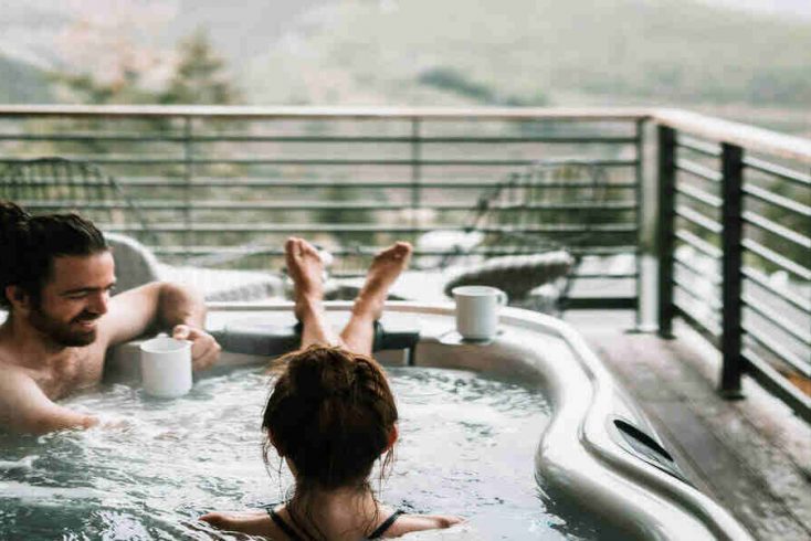 A couple enjoying hot tub getaways