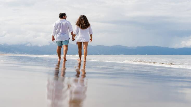 A couple enjoying romantic vacations by the sea