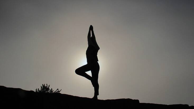 Someone on a yoga retreat in the great outdoors