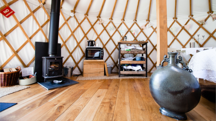 Traditional Mongolian interior of yurt rental for UK winter breaks for couples. 