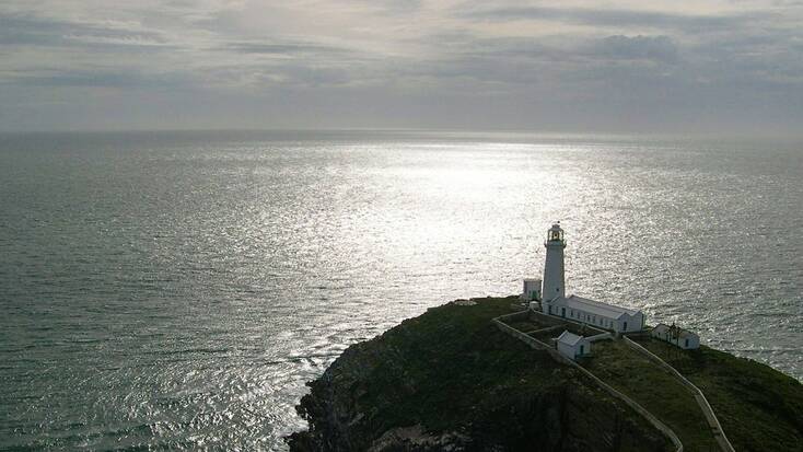 A view over an Anglesey lighthouse and the ocean