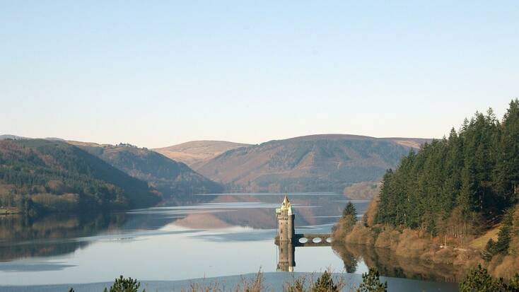 A castle in Wales on a lake 