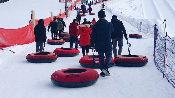 People going snow tubing for their winter outdoor activities, Big Bear CA