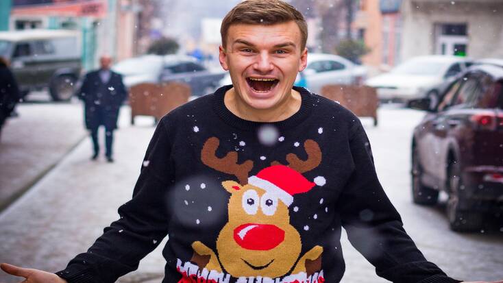 A man wearing his Christmas sweater