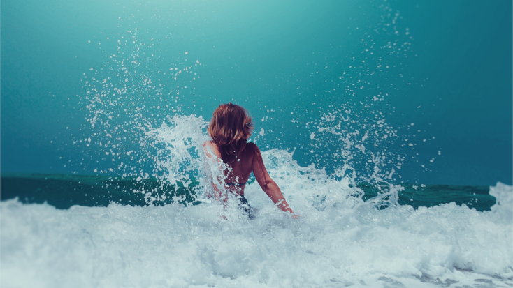 Woman standing in a clean ocean