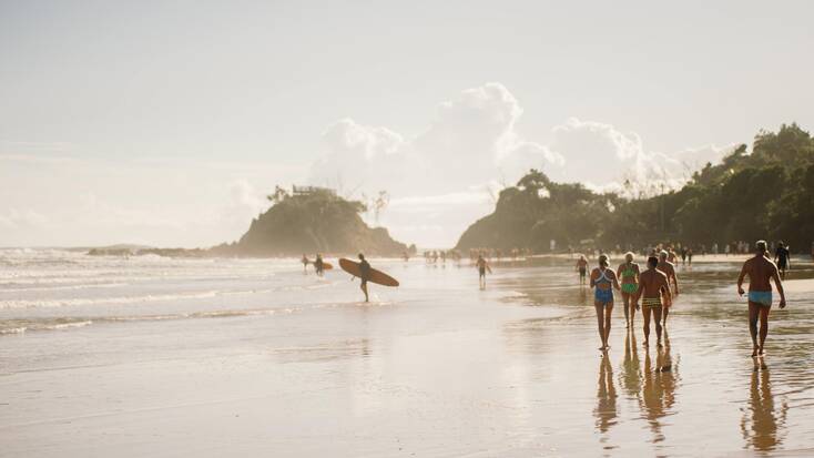 People enjoying a visit to Byron Bay beach