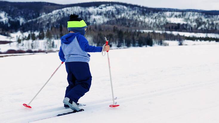 A child trying cross country skiing