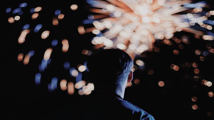 Someone watching fireworks for New Year