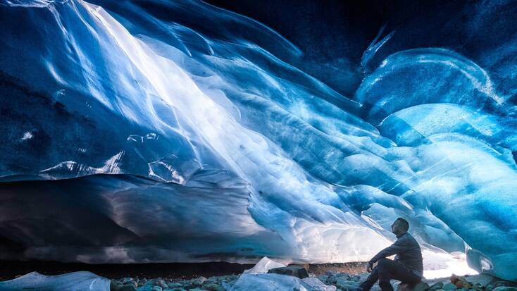 A man in an ice cave