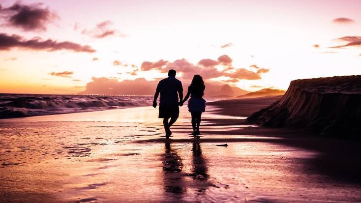 A couple enjoying romantic getaways at the beach