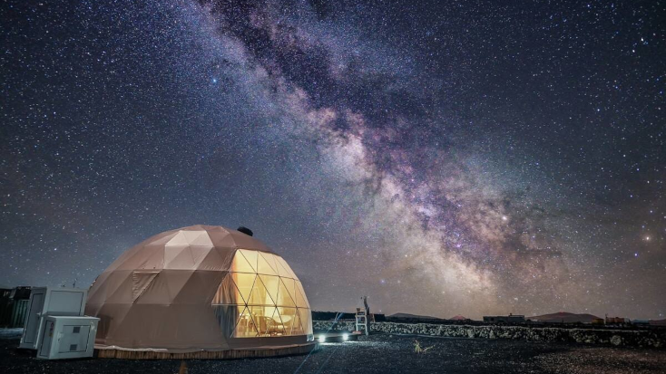 2022 travel trends include glamping in accommodations like a dome.