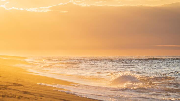 Sunset over the beach in Cape Cod, Massachusetts, the home state of 2 great American Poets