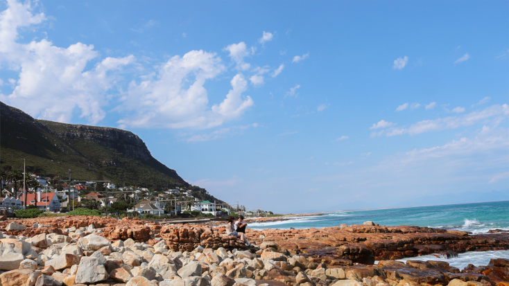 Best hiking trails Cape Town: view of the Kalk Bay Mountains from Kalk Bay beach