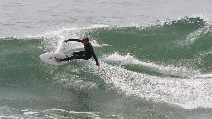 Big wave surfing in Huntington Beach, CA