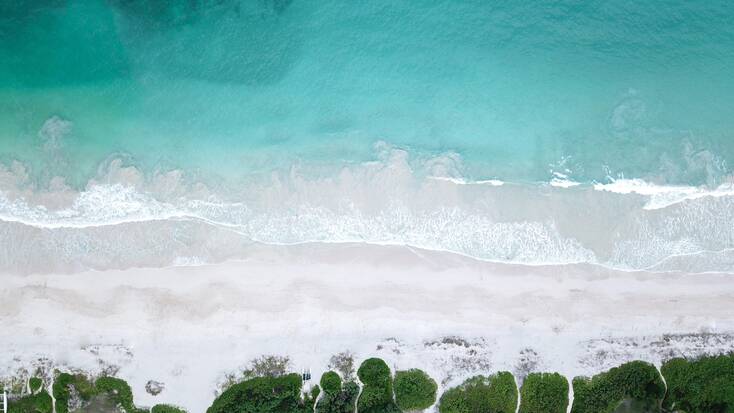 An aerial view over Kailua Beach Park, for family summer vacations