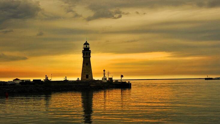 Sunset over a lighthouse on Lake Erie