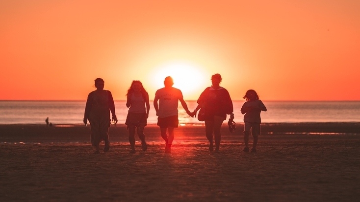 A family enjoying beach vacations in one of our favorite family vacation spots 2022