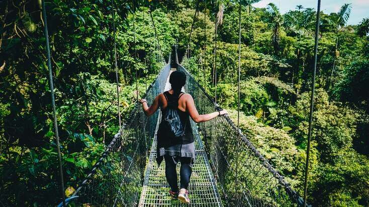 A tourist discovering some of the tropical places to visit in Costa Rica