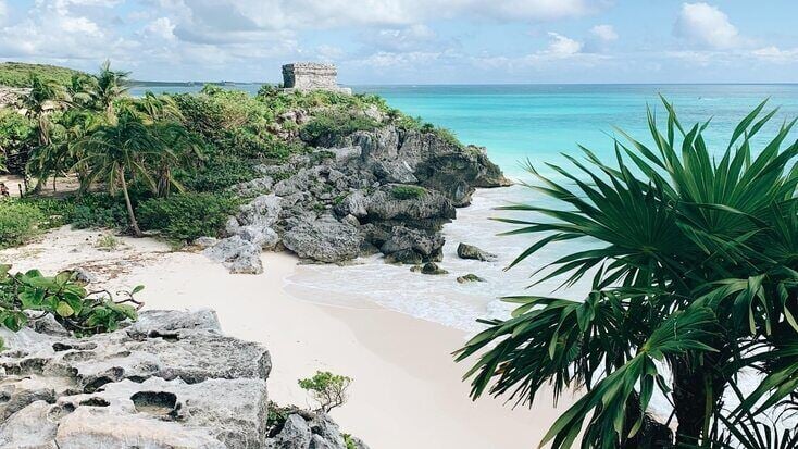 A view over a beach in Quintana Roo and ruins in Mexico