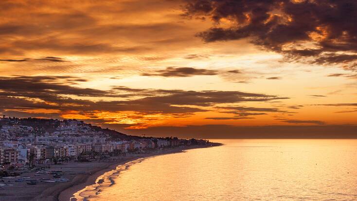 Sunset over El Rincon de la Victoria, one of our favorite Malaga beaches