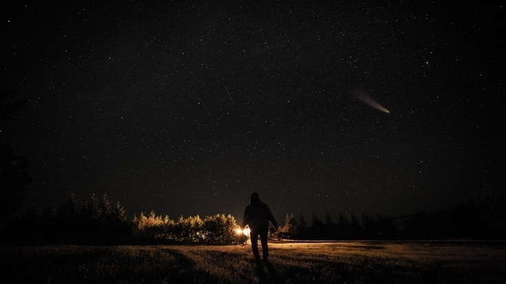 A man viewing the stars during a meteor shower